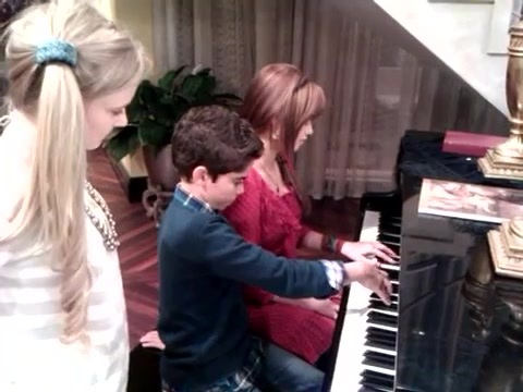 Debby Ryan gives Cameron a quick piano lesson 027