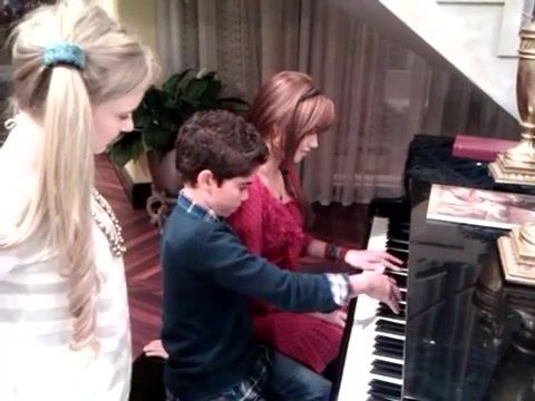 Debby Ryan gives Cameron a quick piano lesson 029