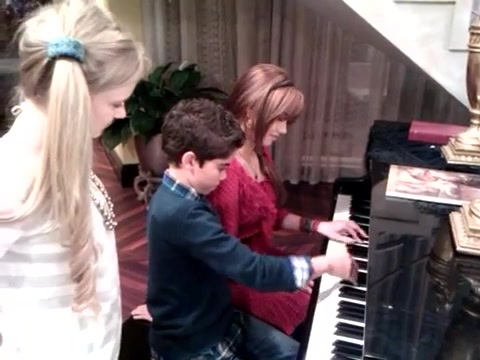 Debby Ryan gives Cameron a quick piano lesson 030