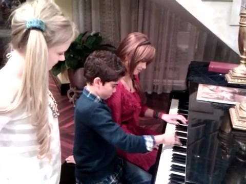 Debby Ryan gives Cameron a quick piano lesson 031