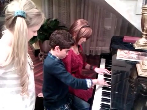 Debby Ryan gives Cameron a quick piano lesson 032