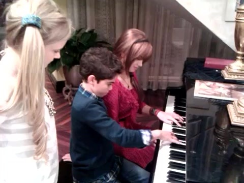 Debby Ryan gives Cameron a quick piano lesson 033