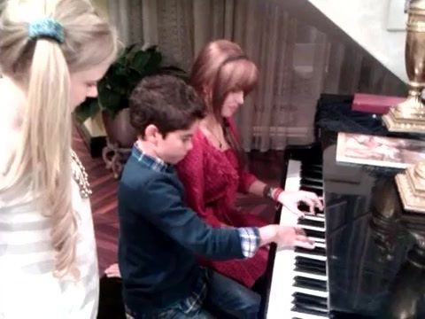 Debby Ryan gives Cameron a quick piano lesson 034
