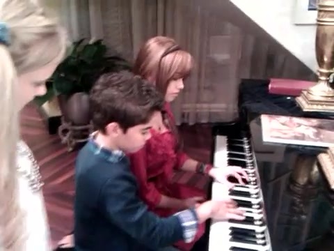 Debby Ryan gives Cameron a quick piano lesson 038