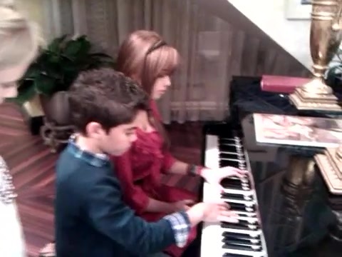 Debby Ryan gives Cameron a quick piano lesson 039