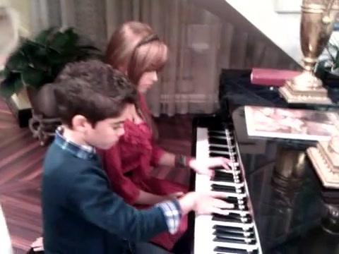 Debby Ryan gives Cameron a quick piano lesson 040