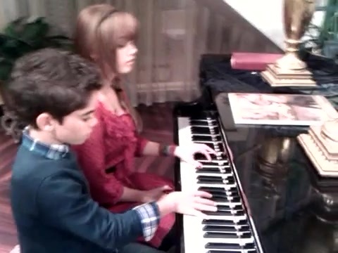 Debby Ryan gives Cameron a quick piano lesson 042