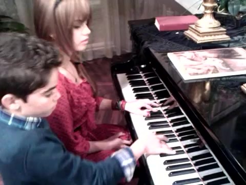 Debby Ryan gives Cameron a quick piano lesson 048