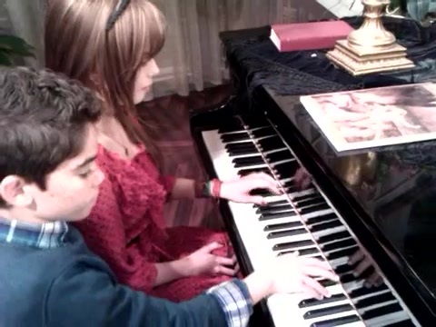 Debby Ryan gives Cameron a quick piano lesson 060