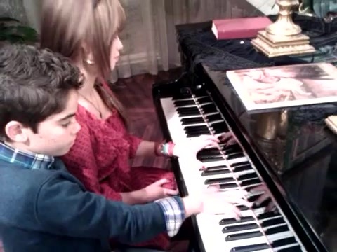 Debby Ryan gives Cameron a quick piano lesson 068