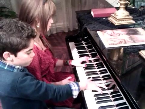 Debby Ryan gives Cameron a quick piano lesson 069