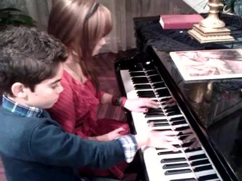 Debby Ryan gives Cameron a quick piano lesson 076