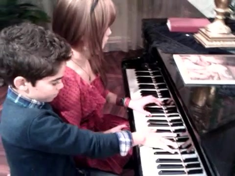 Debby Ryan gives Cameron a quick piano lesson 078