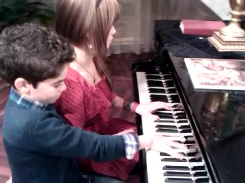 Debby Ryan gives Cameron a quick piano lesson 079