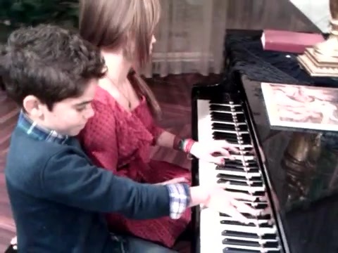 Debby Ryan gives Cameron a quick piano lesson 080