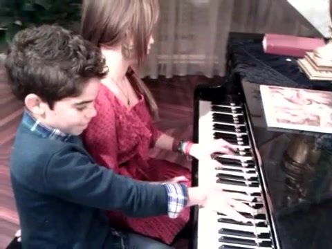 Debby Ryan gives Cameron a quick piano lesson 081
