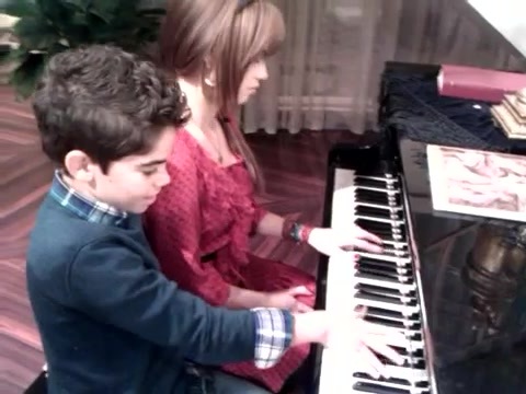 Debby Ryan gives Cameron a quick piano lesson 083