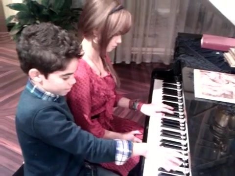 Debby Ryan gives Cameron a quick piano lesson 086