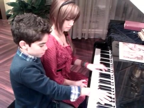 Debby Ryan gives Cameron a quick piano lesson 089