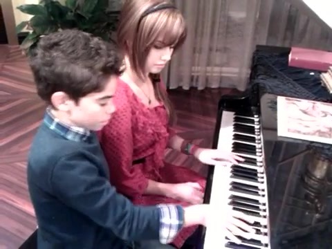 Debby Ryan gives Cameron a quick piano lesson 090