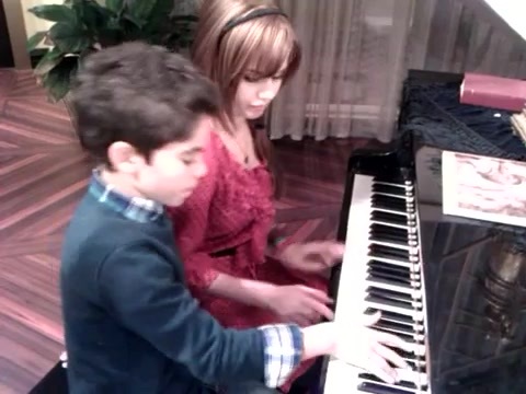 Debby Ryan gives Cameron a quick piano lesson 091