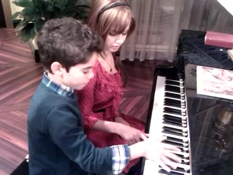 Debby Ryan gives Cameron a quick piano lesson 093
