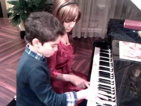 Debby Ryan gives Cameron a quick piano lesson 095