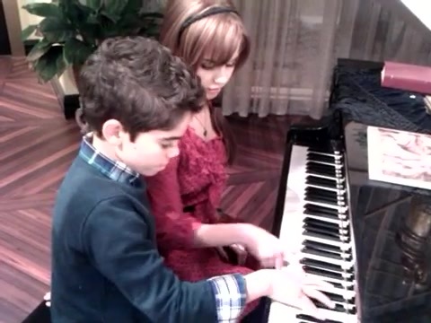 Debby Ryan gives Cameron a quick piano lesson 096