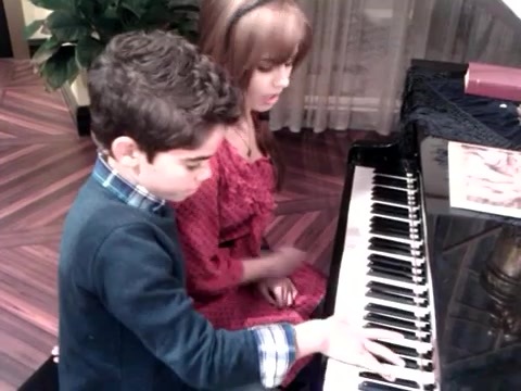 Debby Ryan gives Cameron a quick piano lesson 099