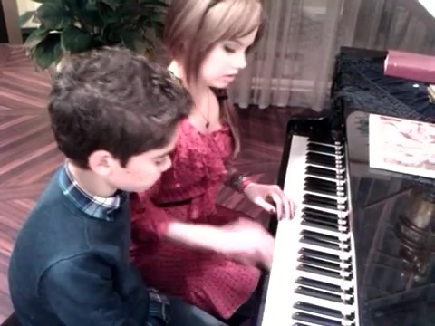 Debby Ryan gives Cameron a quick piano lesson 159