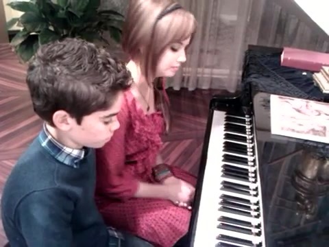 Debby Ryan gives Cameron a quick piano lesson 179