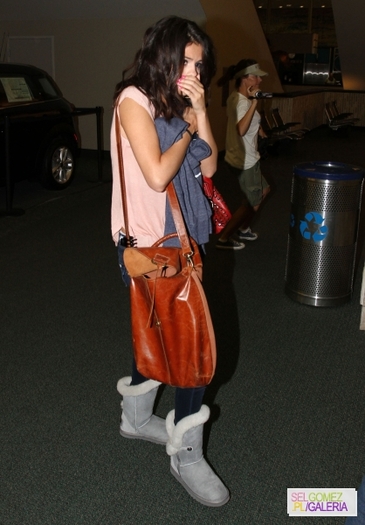 normal_017 - 2 03 2012 Selena at the airport in Tampa FL