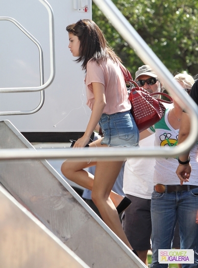 normal_HQ07%7E3 - 2 03 2012 Selena arrives to plan Spring Breakers in Florida