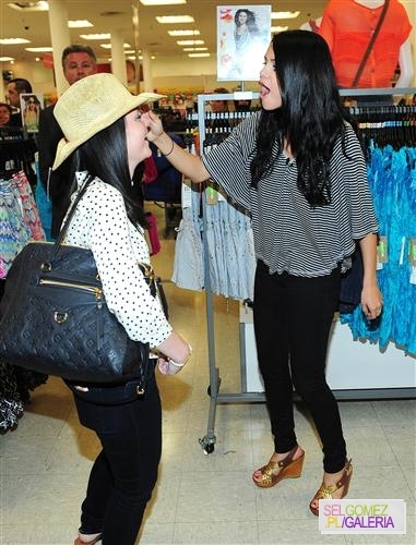 016%7E86 - 24 04 2012 Selena visiting the Kmart store LA