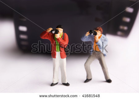 stock-photo-photographers-miniature-figurines-standing-near-a-roll-film-41681548 - figurine