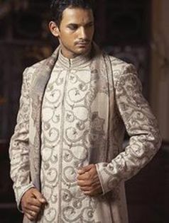 jute_sherwani_highlighted_with_resham_work_and_worn_with_a_shawl - Sherwani