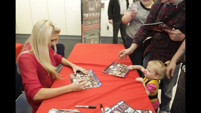 Greet_12102011ca_271 - Kelly Kelly signs her Maxim cover at Fort Bragg