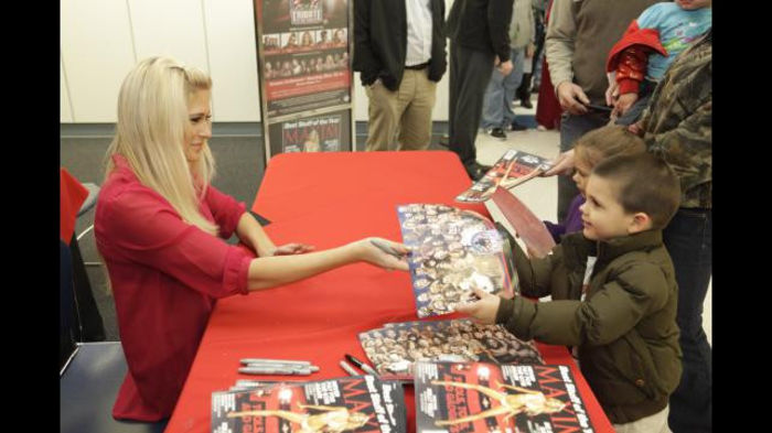 Greet_12102011ca_353 - Kelly Kelly signs her Maxim cover at Fort Bragg