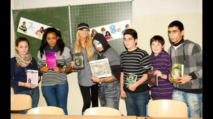 16327898 - Kelly Kelly and Rey Mysterio meet WrestleMania Reading Challenge participants in Cologne Germany