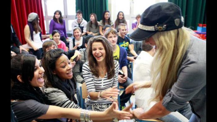 16327970 - Kelly Kelly and Rey Mysterio meet WrestleMania Reading Challenge participants in Cologne Germany