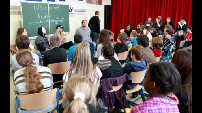 16328030 - Kelly Kelly and Rey Mysterio meet WrestleMania Reading Challenge participants in Cologne Germany