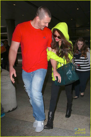 2 - Selena and her stepdad Brian arriving at LAX airport---10 July 2013