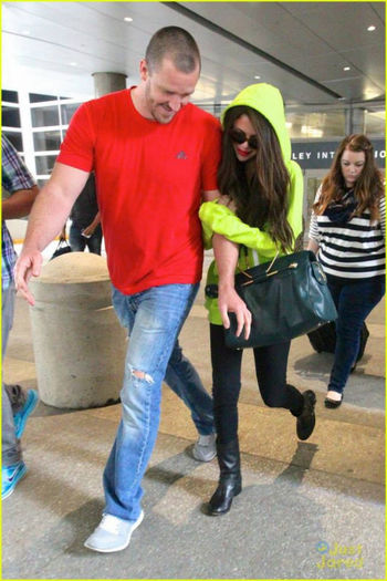 4 - Selena and her stepdad Brian arriving at LAX airport---10 July 2013