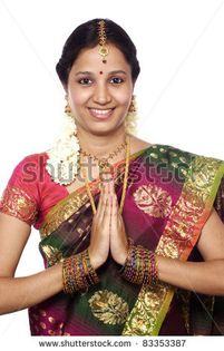 stock-photo-traditional-indian-woman-greeting-namaste-83353387