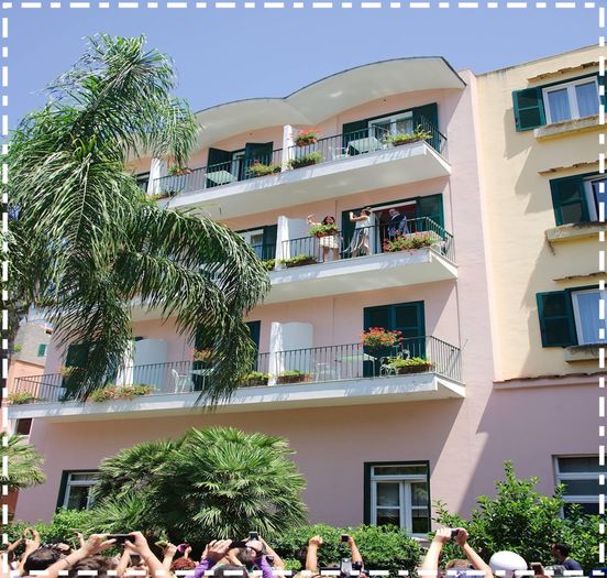  - xz - Waving -her-fans - from - the - b alcony - of - her - hotel -in -Ischia x x