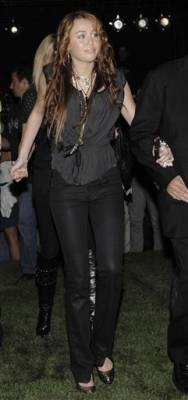 77161_miley-cyrus-arrives-for-the-christian-audigier-presents-american-lord-show-during-mercedes-ben