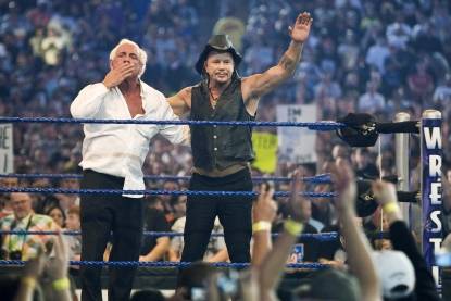 89850_mickey-rourke-celebrates-with-ric-flair-after-beating-wwe-superstar-chris-jericho-during-wrest - WWE LEGENDS-CHRIS JERICHO