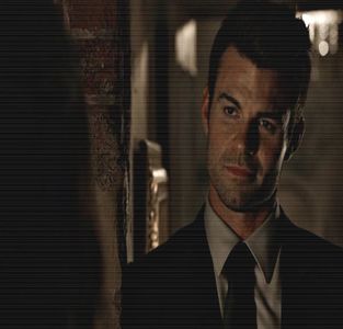 ━ ♘.; Tocmai pe gustul tău. # Îşi arcuieşte colţul gurii într-un zâmbet amuzat şi se ridică; de pe fotoliu, apropiindu-se lent de masa pe care se aflau câteva sticle de băutură, alegând-o pe aceea de whisky şi turnându-şi ulterior din ea într-un pahar.
