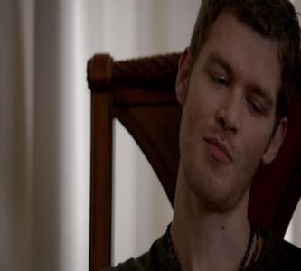 — Hayley, prezența ei reușind să îi aducă pe față unul dintre rânjetele lui ștrengare de; milioane. „Hello, love.” Se ridică de pe fotoliul său, lăsând paharul pe masă și se apropie de aceasta, analizând-o din cap până în picioare. „Mai fermecătoare decât îmi aduceam aminte.”
