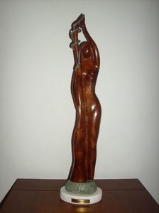 64.EVA * EVE; lemn de mahon + plumb        34 cm
